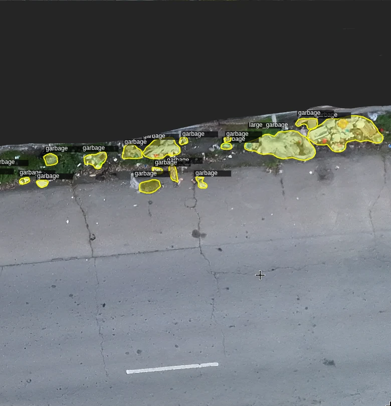 Aerial view with yellow masks labeling detected garbage and large garbage